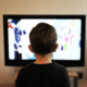 media consumption little boy in front of tv