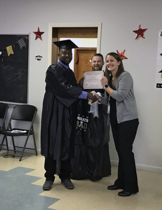 Recovery Services program director Amy with a male program graduate