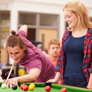 college students playing pool