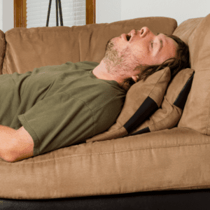 man passed out on couch