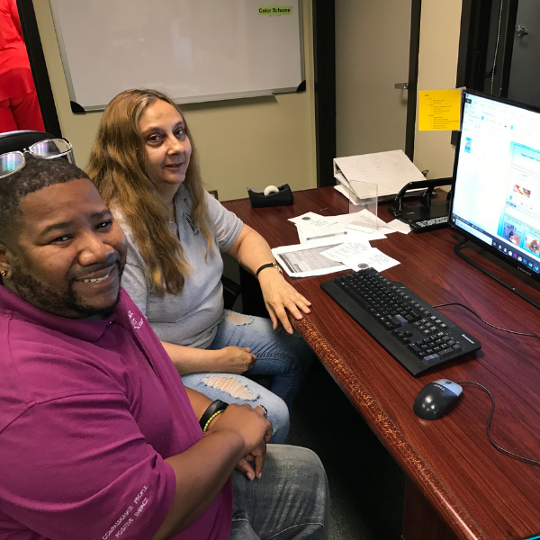 Club Success Assistant Director Deonte with clubhouse member Mary working in media unit