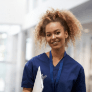 blog feature image nurse in dark blue smiling