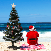 santa on beach with christmas tree