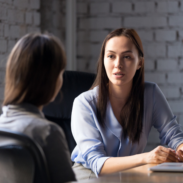 women having serious conversation