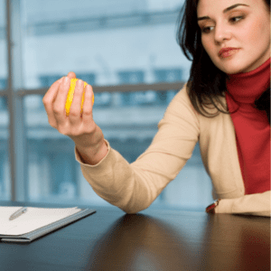 female squeezing stress ball