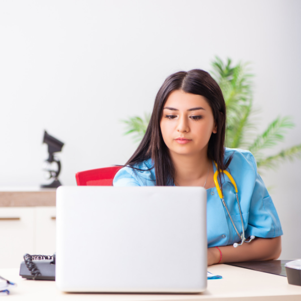 nurse practitioner at laptop