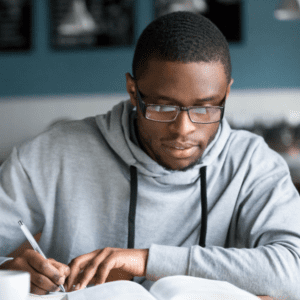 student with glasses studying
