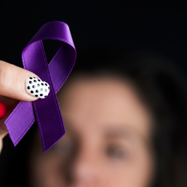 purple ribbon in hand