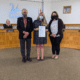 Lakeland Mayor Mutz, Peace River Center Director of Victim Services Kirsten Pindar and COO Candace Barnes accepting the Lakeland DVAM proclamation