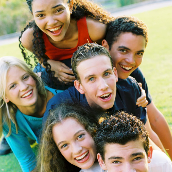 group of teens stacked up together