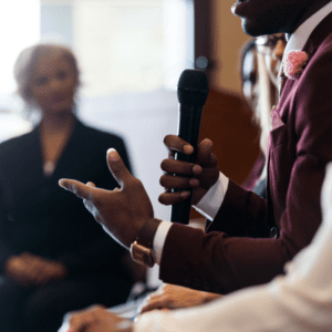 man with microphone at panel discussion