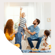 family with child on couch and toy plane