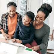 mom and kids working together at desk