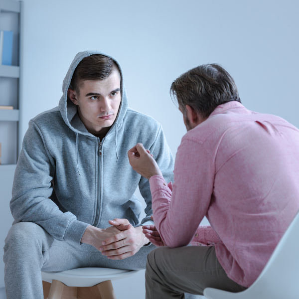 substance use therapist talking to client stock image