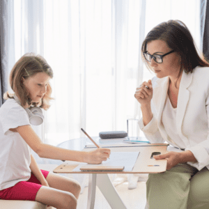 child and therapist in home stock image
