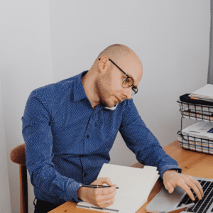 man on phone at desk stock image