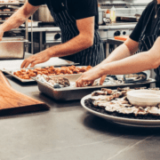 two cooks prepping food