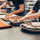 two cooks prepping food