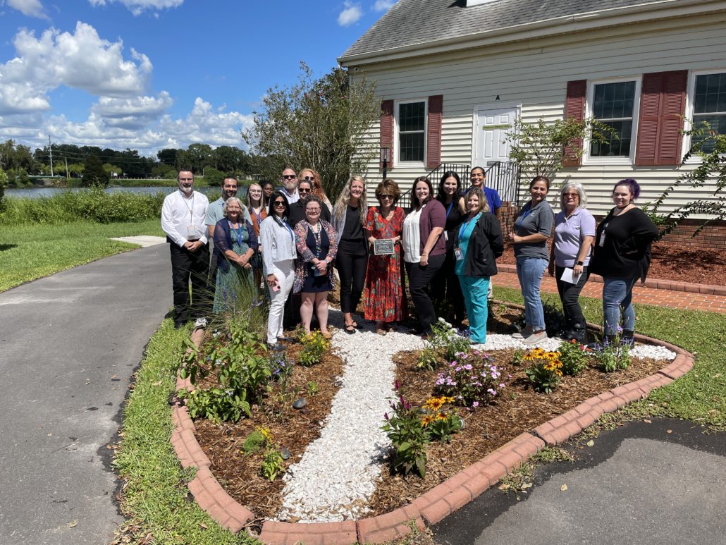 Peace River Center Children's Services team with Nan Langston at her garden dedication