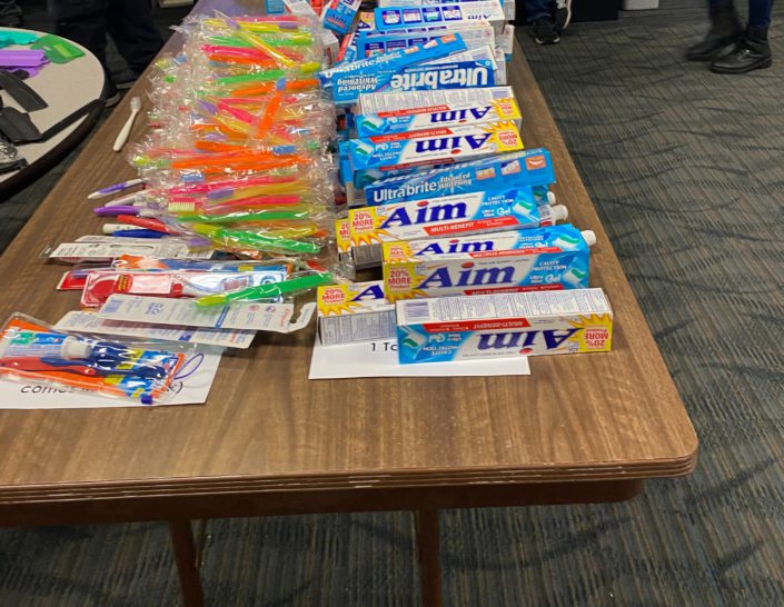 Multiple toothpastes and brushes on a table